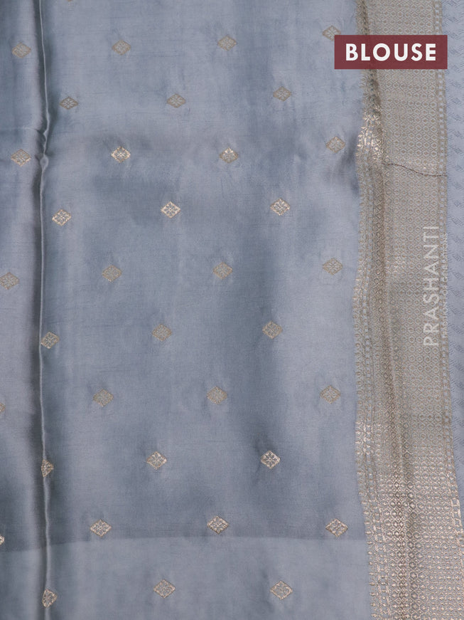 Mushru silk saree grey with allover self emboss and zari woven butta border