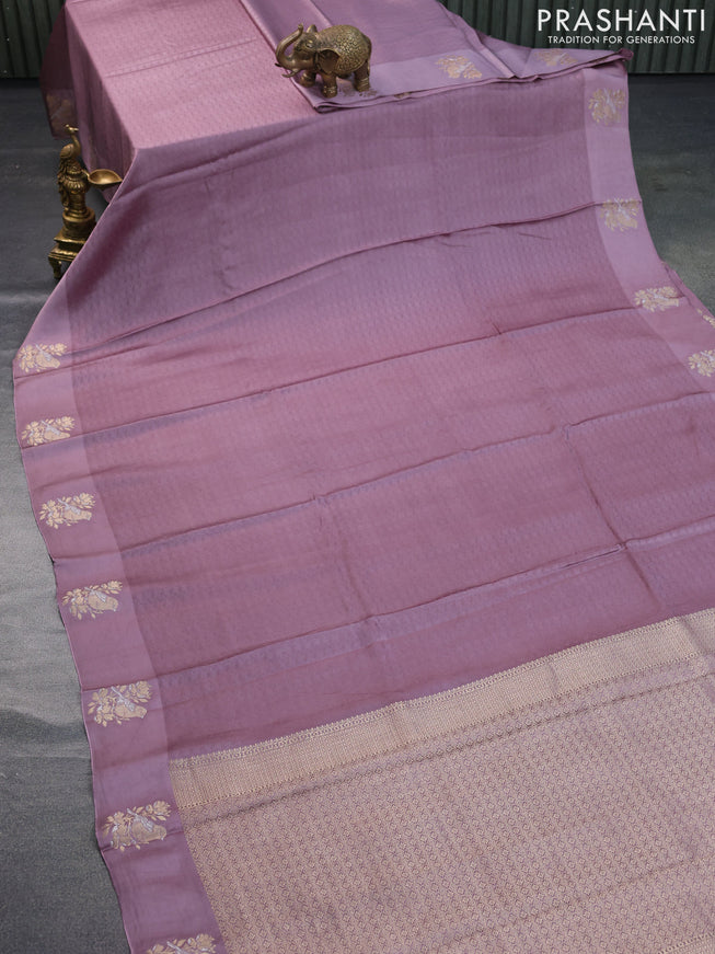 Mushru silk saree pastel purple with allover self emboss and zari woven butta border