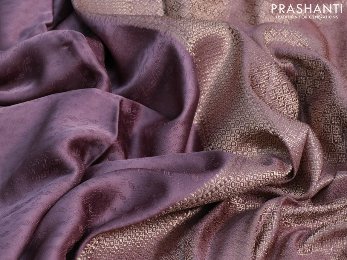 Mushru silk saree pastel purple with allover self emboss and zari woven butta border