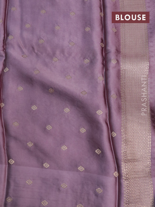 Mushru silk saree pastel purple with allover self emboss and zari woven butta border