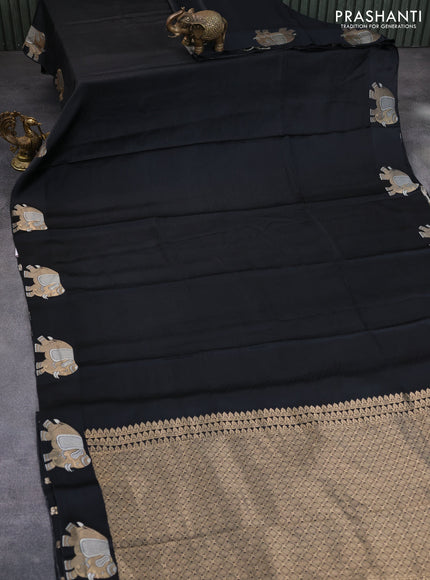 Mushru silk saree black with allover self emboss and zari woven elephant butta border