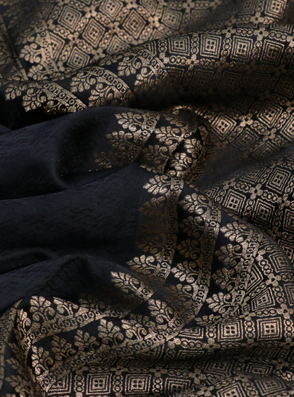 Mushru silk saree black with allover self emboss and zari woven elephant butta border