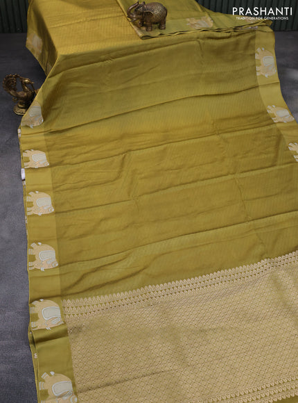 Mushru silk saree olive green with allover self emboss and zari woven elephant butta border