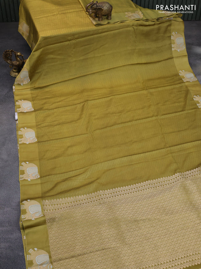 Mushru silk saree olive green with allover self emboss and zari woven elephant butta border