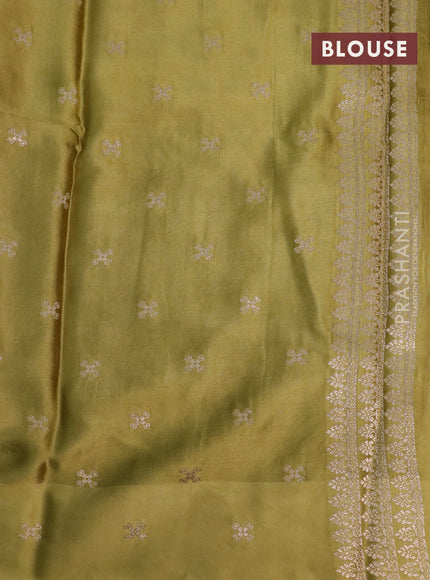 Mushru silk saree olive green with allover self emboss and zari woven elephant butta border