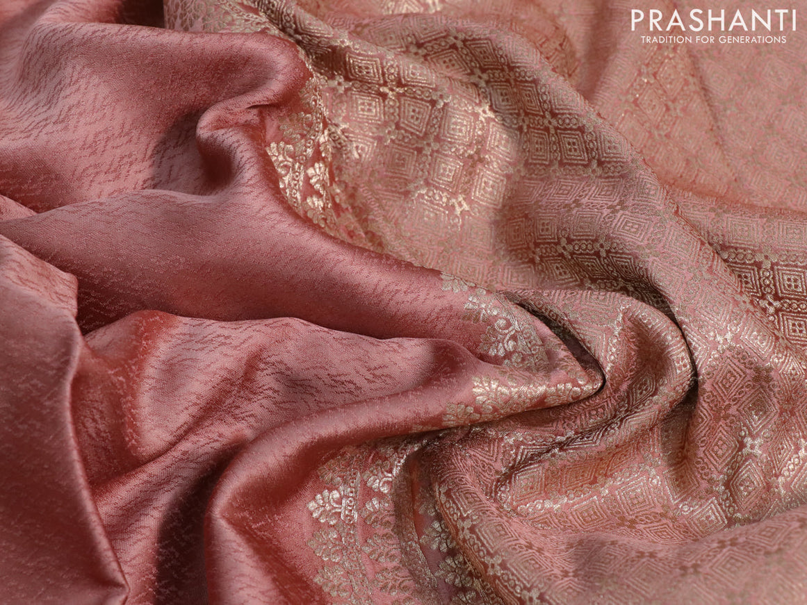 Mushru silk saree pastel peach with allover self emboss and zari woven elephant butta border