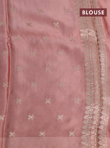 Mushru silk saree pastel peach with allover self emboss and zari woven elephant butta border