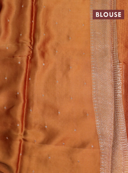 Mushru silk saree rust shade with allover self emboss and zari woven butta border