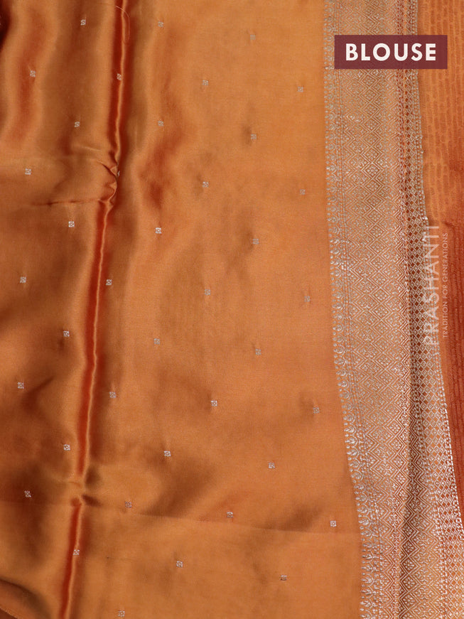 Mushru silk saree rust shade with allover self emboss and zari woven butta border