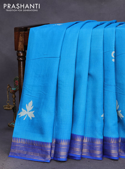 Munga tussar silk saree cs blue and blue with leaf butta prints and zari woven border