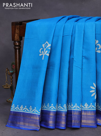 Munga tussar silk saree cs blue and blue with floral butta prints and zari woven border