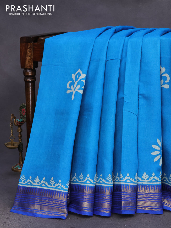 Munga tussar silk saree cs blue and blue with floral butta prints and zari woven border