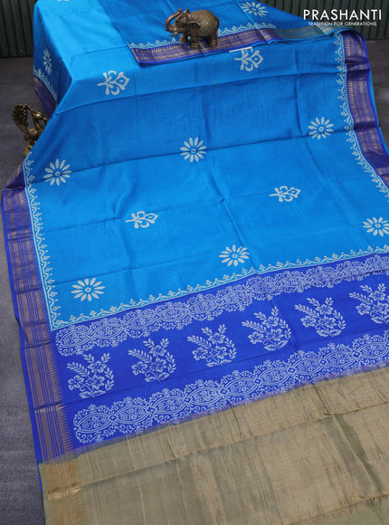 Munga tussar silk saree cs blue and blue with floral butta prints and zari woven border