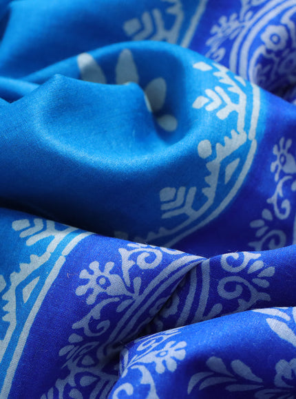 Munga tussar silk saree cs blue and blue with floral butta prints and zari woven border