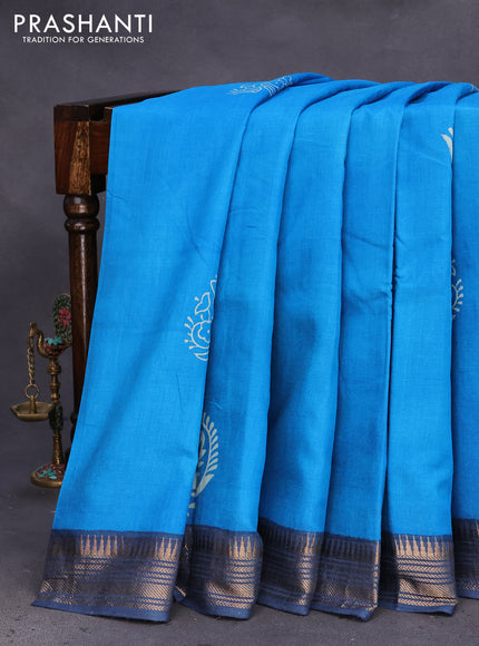 Munga tussar silk saree cs blue and grey with paisley butta prints and zari woven border