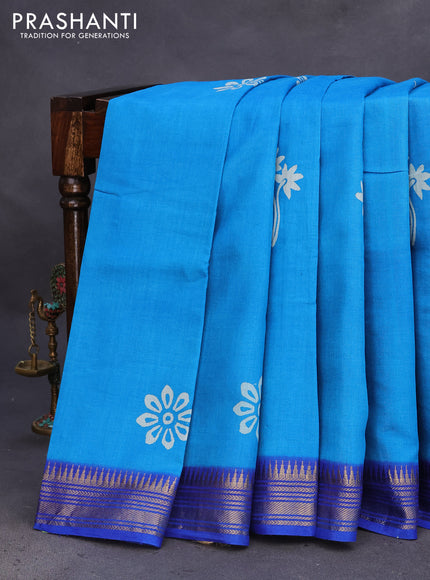 Munga tussar silk saree cs blue and blue with floral butta prints and zari woven border