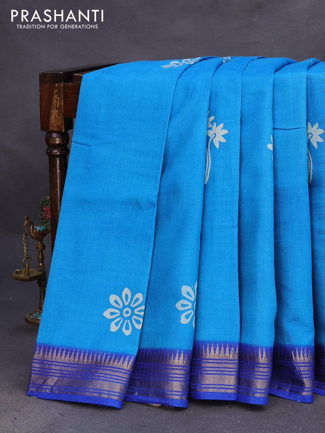 Munga tussar silk saree cs blue and blue with floral butta prints and zari woven border