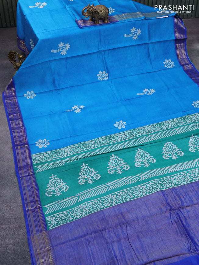 Munga tussar silk saree cs blue and blue with floral butta prints and zari woven border