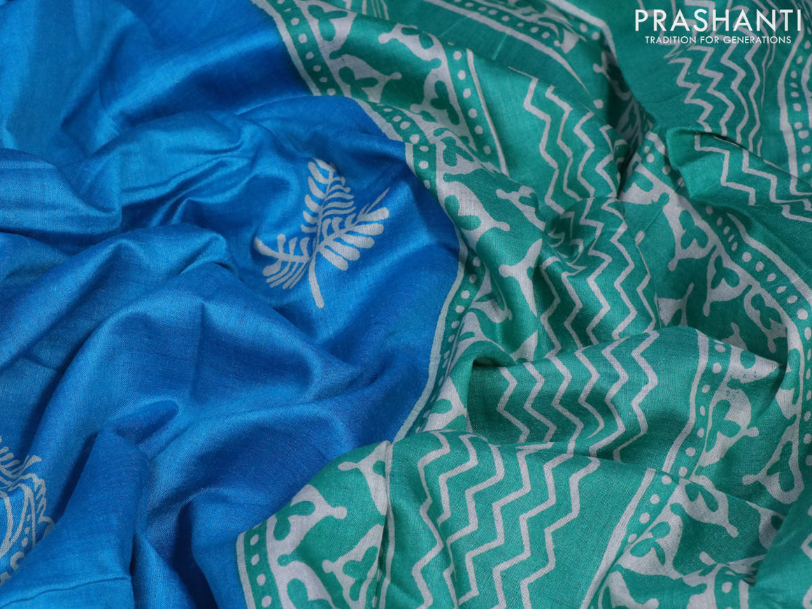 Munga tussar silk saree cs blue and blue with butta prints and zari woven border