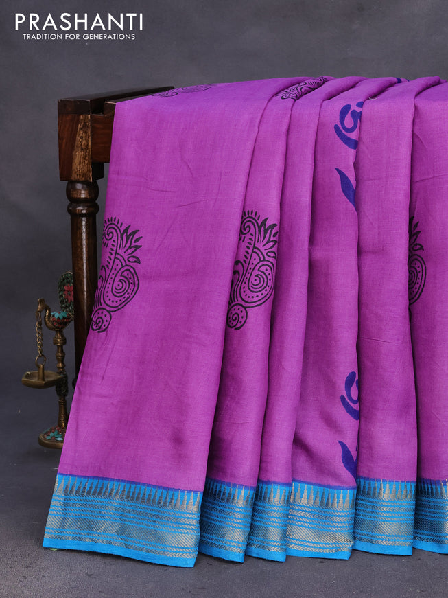 Munga tussar silk saree purple shade and cs blue with floral butta prints and zari woven border