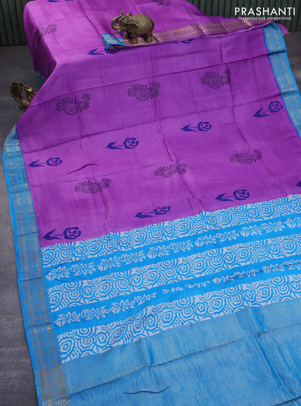 Munga tussar silk saree purple shade and cs blue with floral butta prints and zari woven border