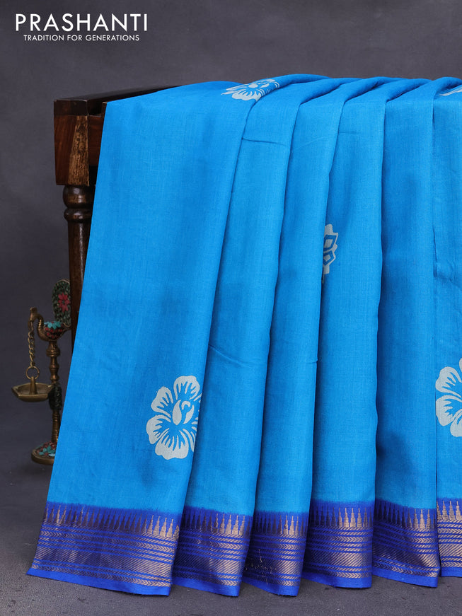 Munga tussar silk saree cs blue and blue with floral butta prints and zari woven border