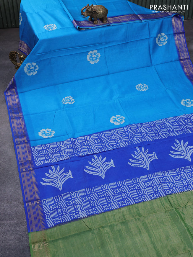 Munga tussar silk saree cs blue and blue with floral butta prints and zari woven border