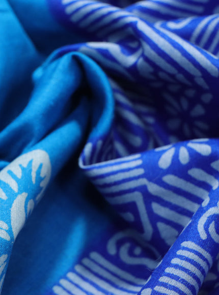 Munga tussar silk saree cs blue and blue with floral butta prints and zari woven border