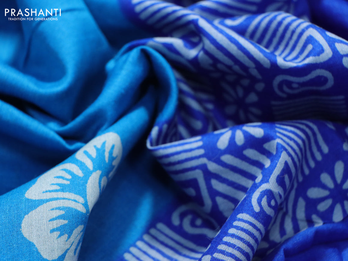 Munga tussar silk saree cs blue and blue with floral butta prints and zari woven border