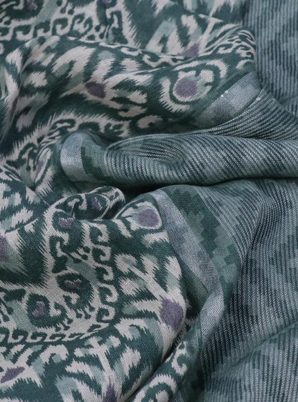 Pure linen saree sap green with allover ikat prints and silver zari woven piping border