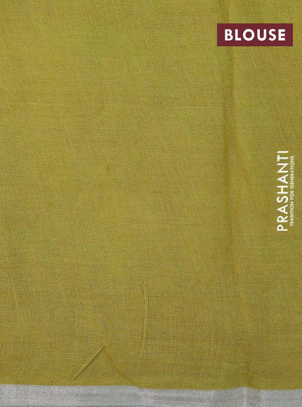 Pure linen saree lime green with allover floral prints and silver zari woven piping border