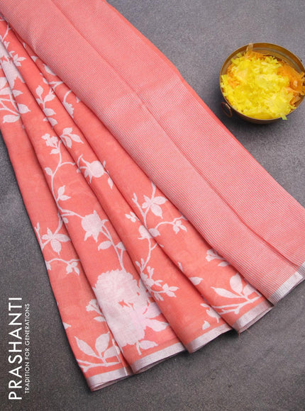 Pure linen saree peach orange with allover floral prints and silver zari woven piping border