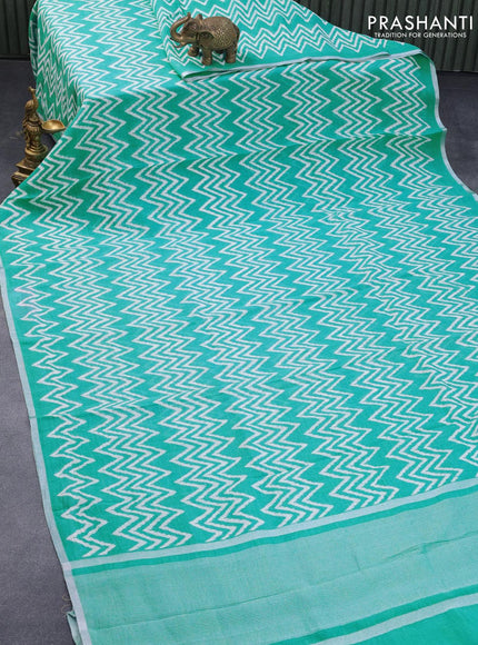 Pure linen saree teal blue with allover zig zag prints and silver zari woven piping border