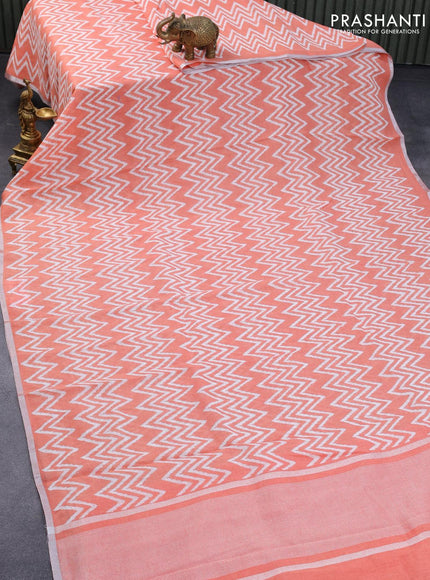 Pure linen saree peach orange with allover zig zag prints and silver zari woven piping border