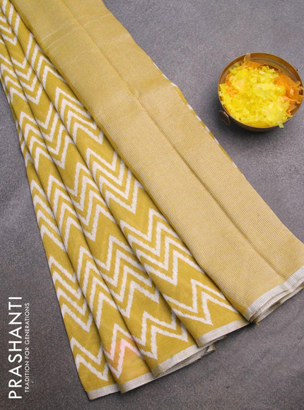 Pure linen saree lime yellow with allover zig zag prints and silver zari woven piping border