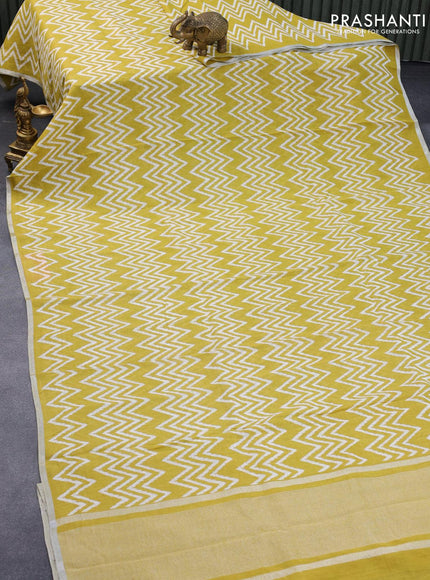 Pure linen saree lime yellow with allover zig zag prints and silver zari woven piping border