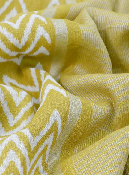 Pure linen saree lime yellow with allover zig zag prints and silver zari woven piping border