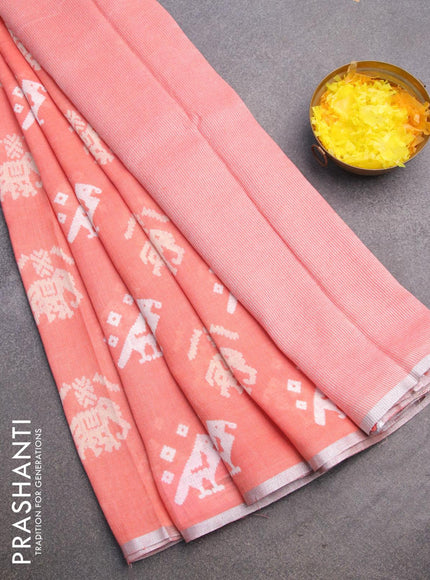 Pure linen saree peach orange with patola prints and silver zari woven piping border