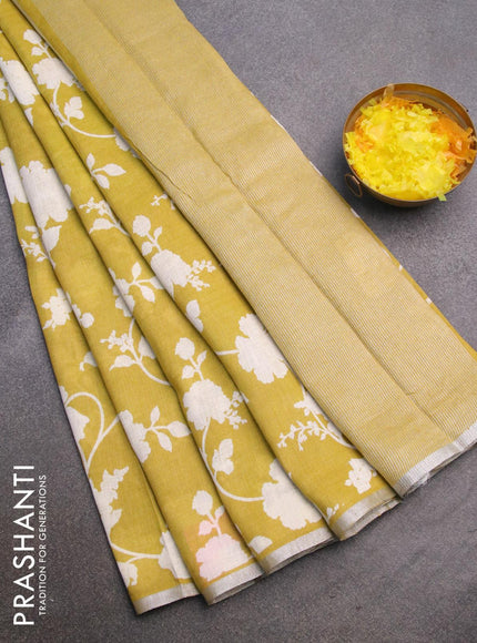 Pure linen saree lime yellow with allover floral prints and silver zari woven piping border