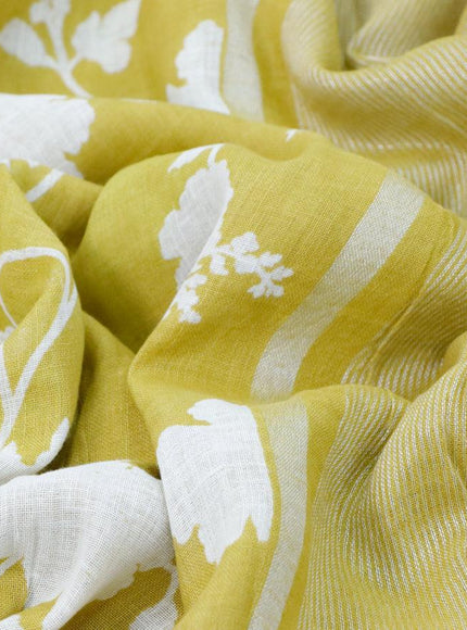 Pure linen saree lime yellow with allover floral prints and silver zari woven piping border