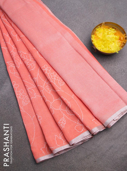 Pure linen saree peach orange with allover prints and silver zari woven piping border