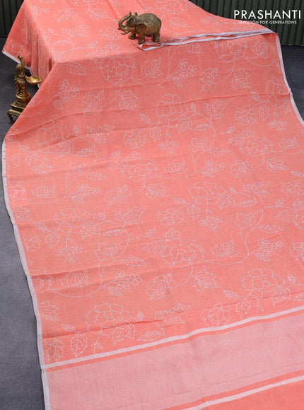 Pure linen saree peach orange with allover prints and silver zari woven piping border