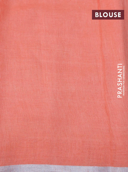 Pure linen saree peach orange with allover prints and silver zari woven piping border