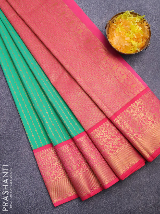 Semi kanjivaram silk saree teal green and pink with allover zari weaves and zari woven korvai border