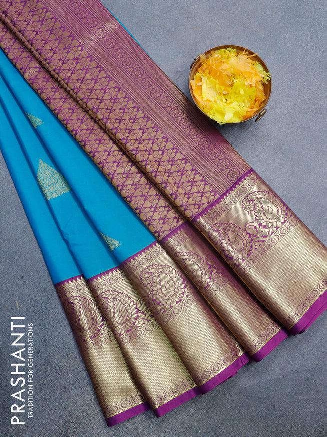 Semi kanjivaram silk saree dual shade of blue and purple with zari woven geometric buttas and long paisley zari woven korvai border