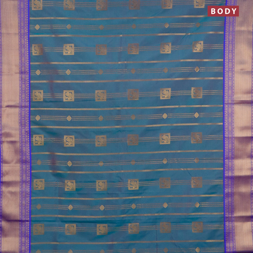 Semi kanjivaram silk saree dual shade of greenish pink and royal blue with allover zari weaves and zari woven korvai border