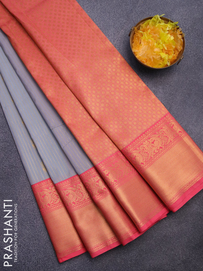 Semi kanjivaram silk saree grey and peach shade with allover zari stripes & buttas and long zari woven korvai border