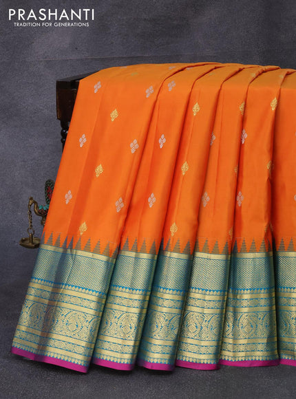 Pure gadwal silk saree orange and cs blue with silver & gold zari woven buttas and temple design zari woven border