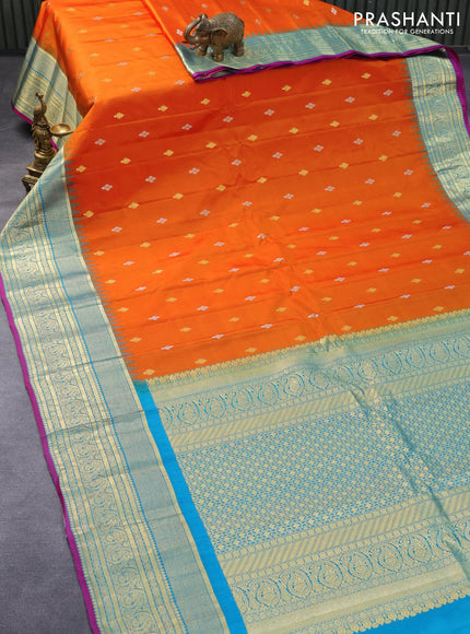 Pure gadwal silk saree orange and cs blue with silver & gold zari woven buttas and temple design zari woven border