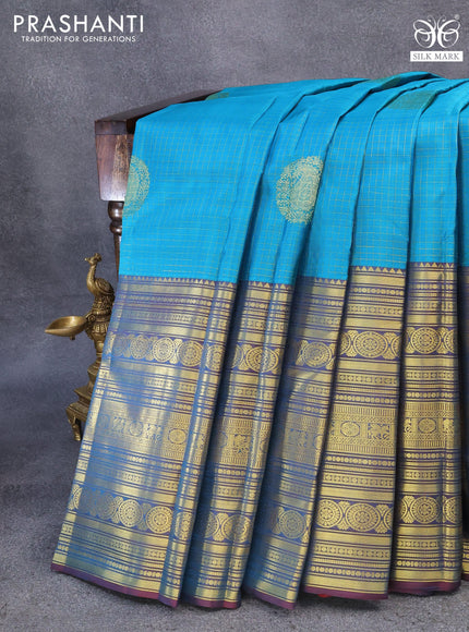 Pure kanjivaram silk saree cs blue and dual shade of maroon with allover zari checks & buttas and long zari woven border